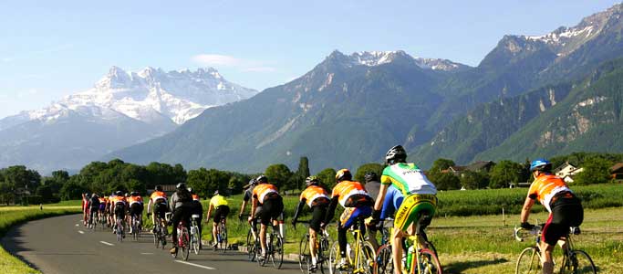 Riders approach the Dents du Midi in the Cyclotour du Léman