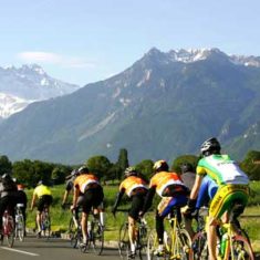 Riders approach the Dents du Midi in the Cyclotour du Léman