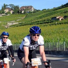 A peloton of cyclists ride through the Lavaux vineyards in the Cyclotour du Léman, part of Brevet's Cyclotour du Léman cycling sportive holiday.