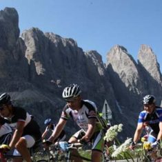 A small group of friends riding together through the beautiful scenery of the Maratona dles Dolomites. Photo Credit: Freddy Planinschek.